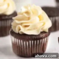 A chocolate cupcake topped with rich, nutty brown butter frosting, ready to be enjoyed.