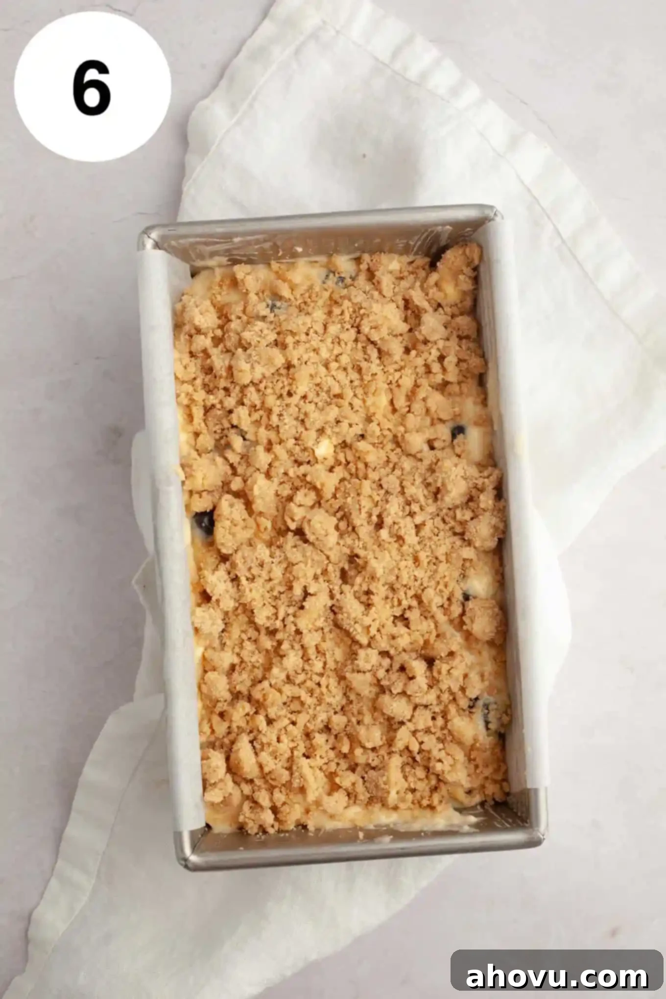 An overhead view of an unbaked blueberry loaf. 