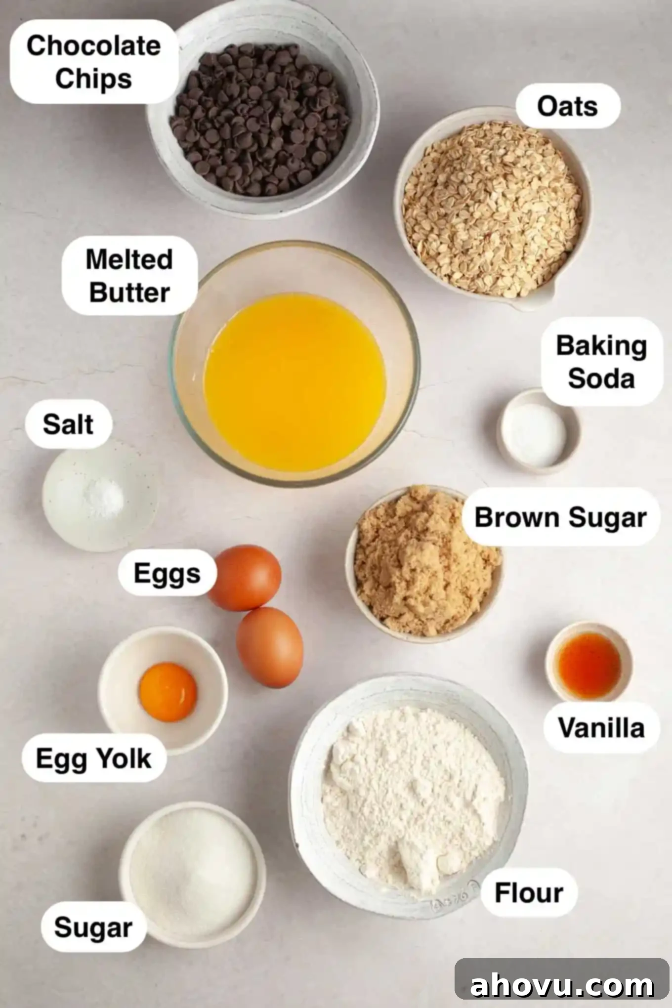 An overhead view of the ingredients for oatmeal bar cookies laid out on a kitchen counter.