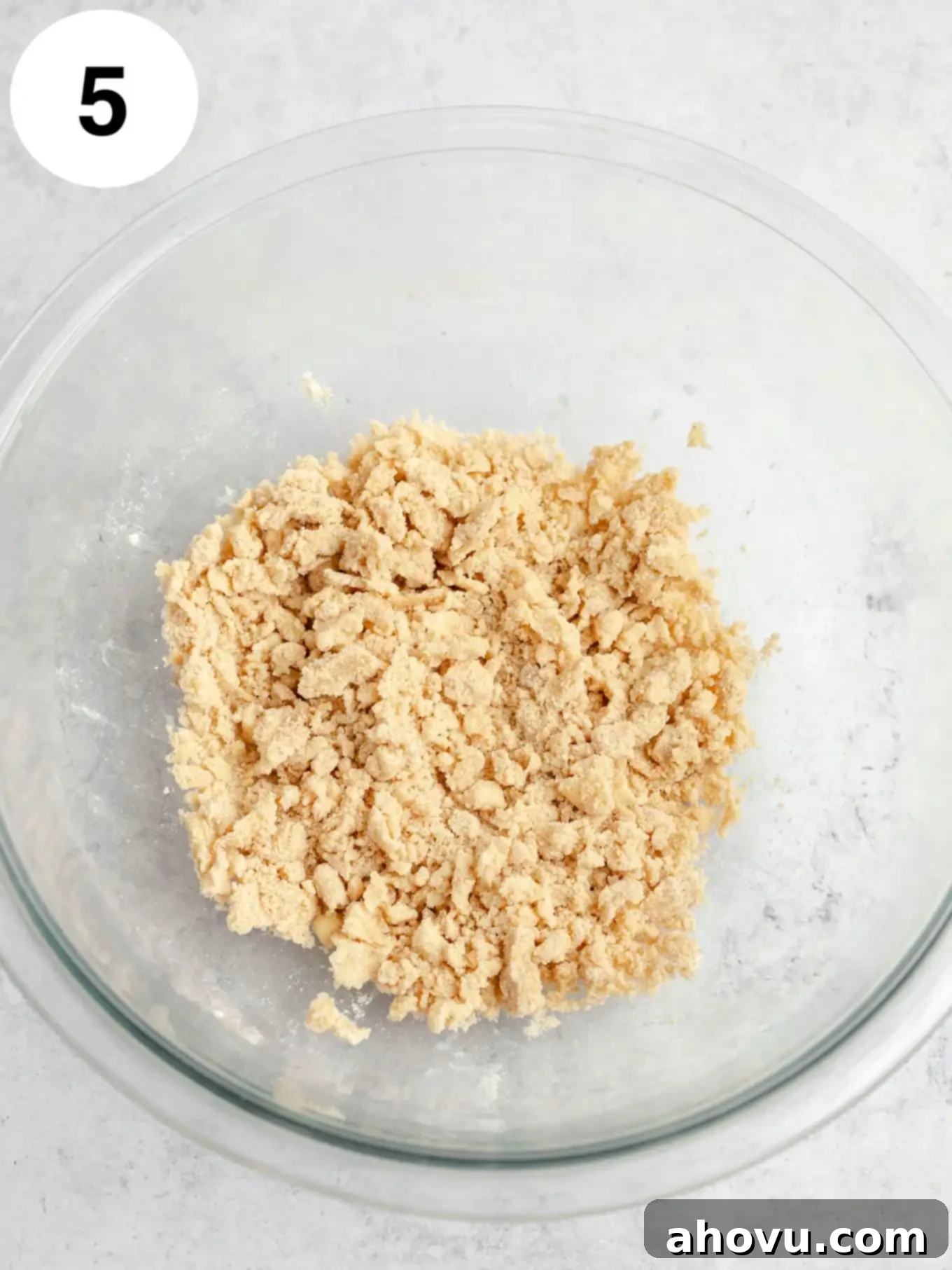 Streusel topping in a glass mixing bowl.