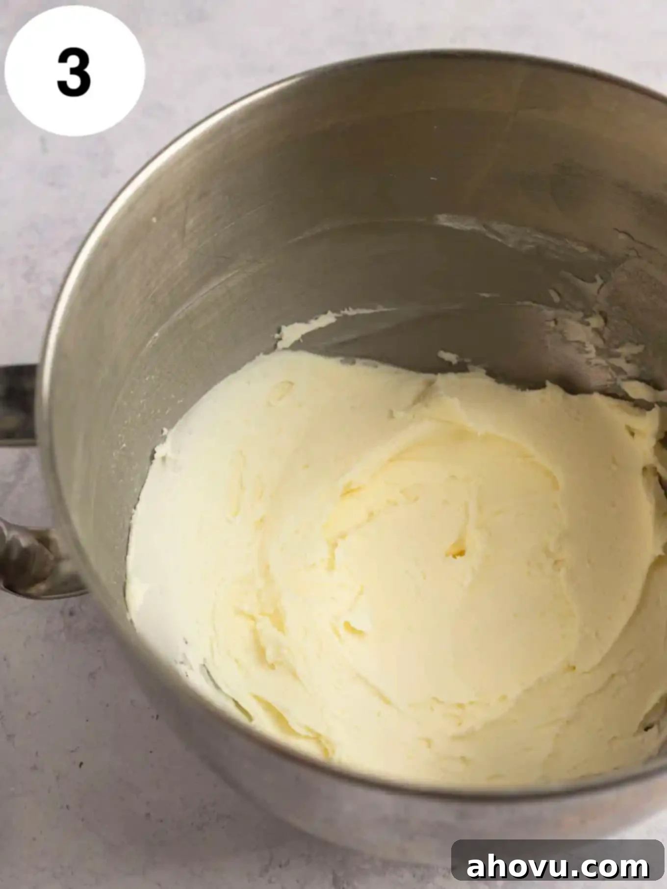Butter and powdered sugar beaten together in the bowl of a stand mixer. 