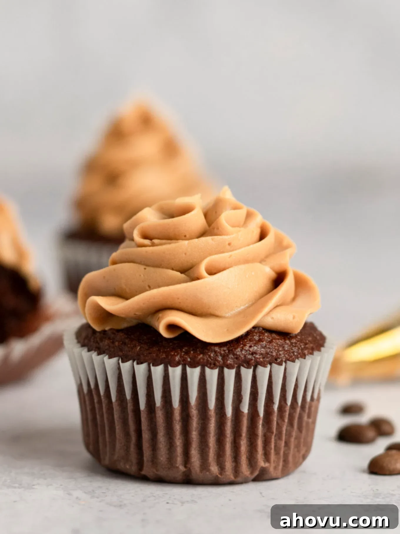 A chocolate cupcake topped with coffee frosting. 