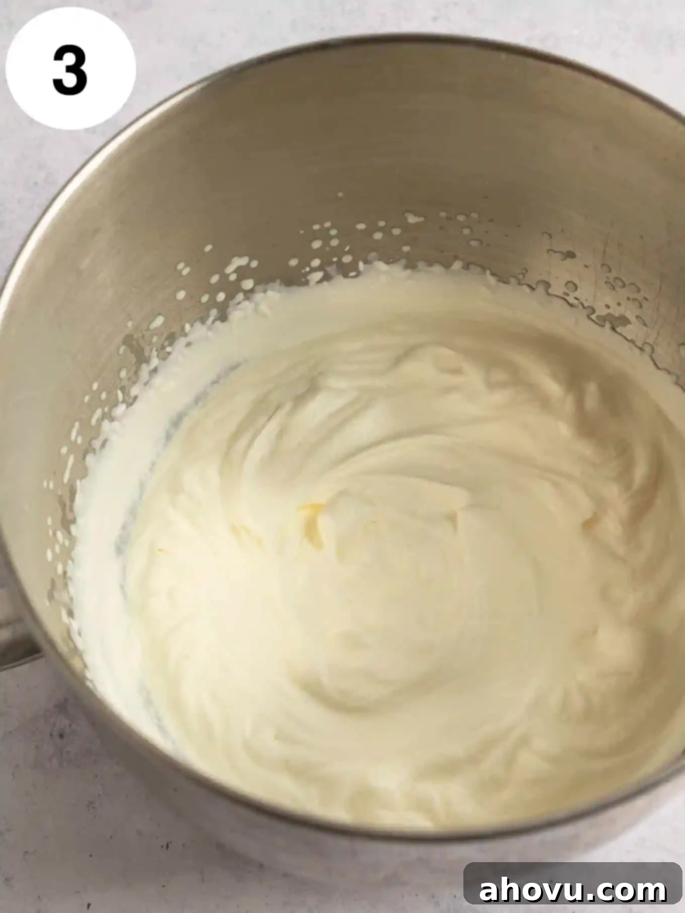 Velvet Peanut Butter Freeze 6 An overhead view of perfectly whipped heavy cream forming stiff peaks in the bowl of a stand mixer.