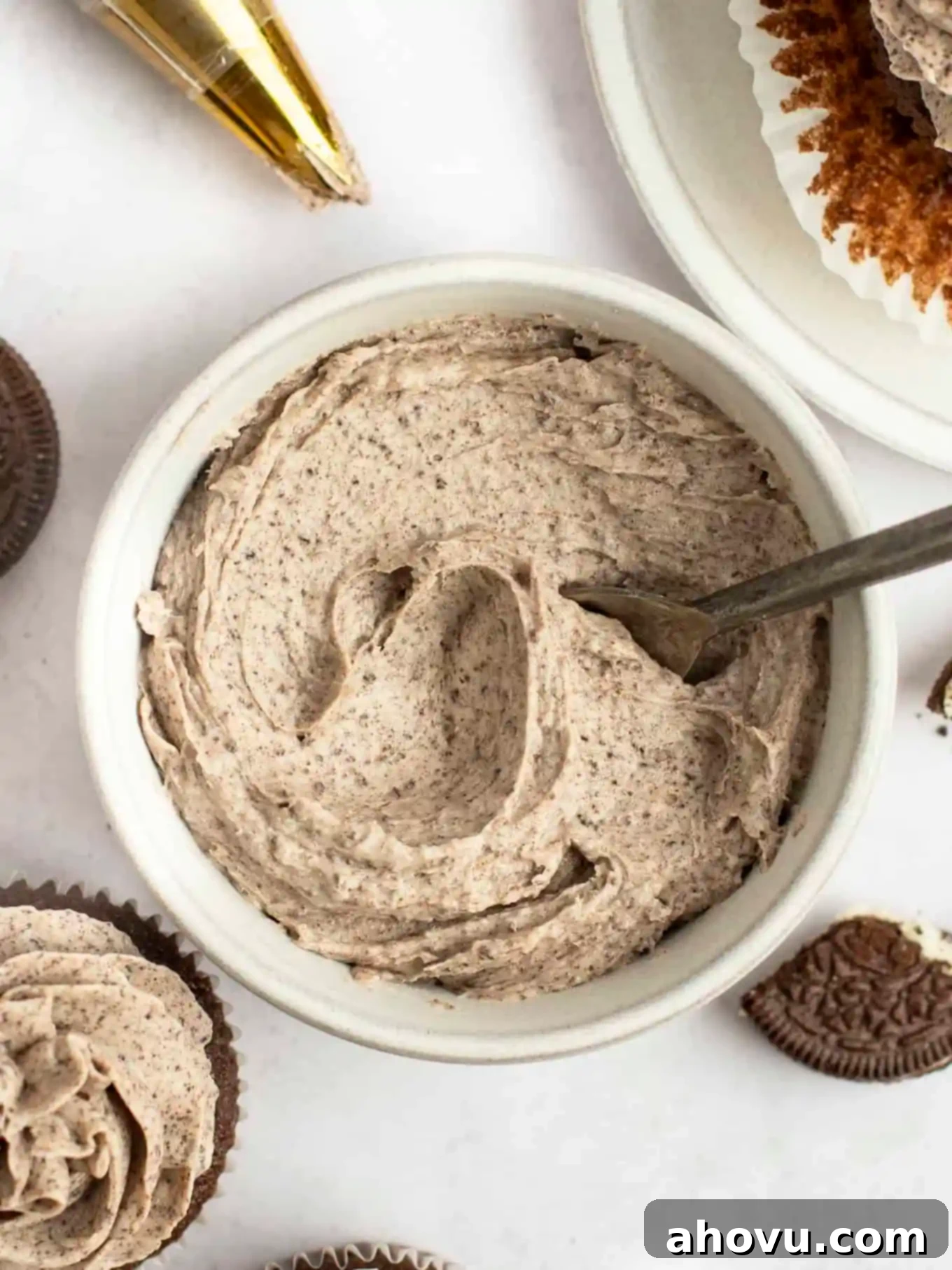 An overhead view of Oreo frosting in a white bowl. 