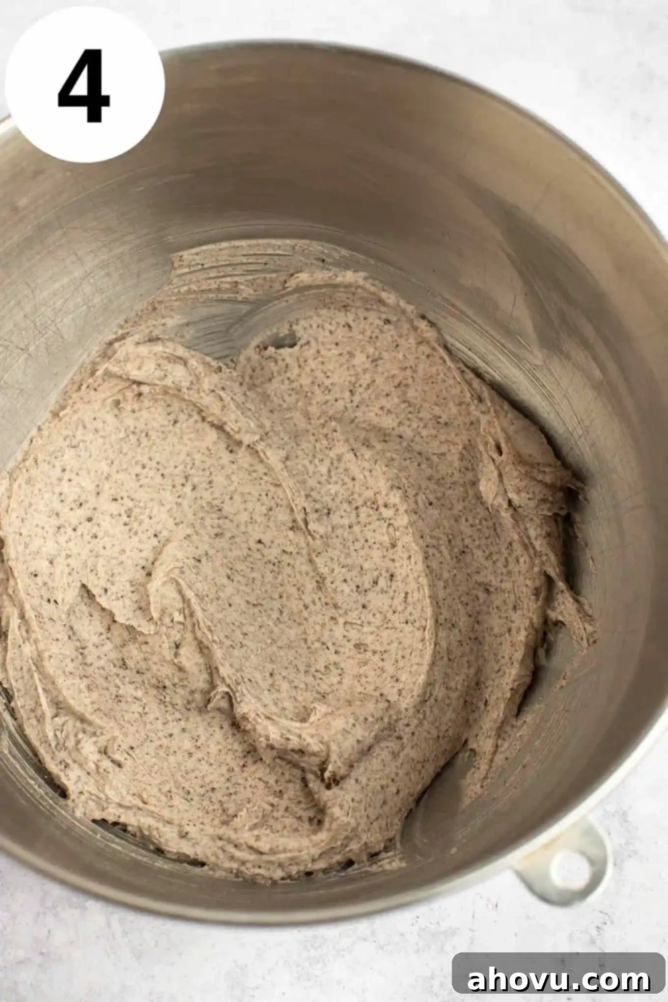 An overhead view of Oreo frosting in a metal mixing bowl. 