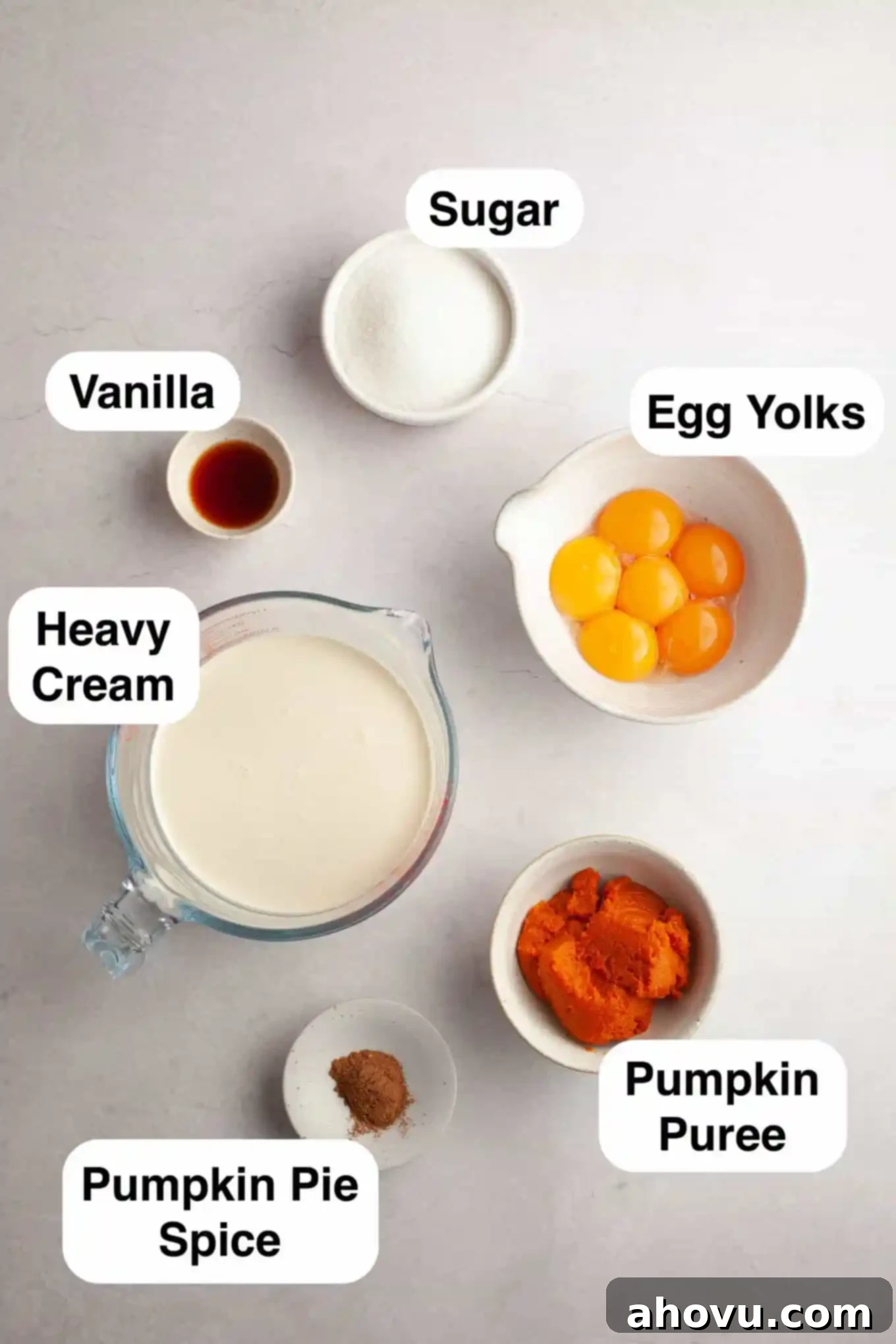 An overhead view of the simple, high-quality ingredients needed to make pumpkin spice crème brûlée from scratch. 