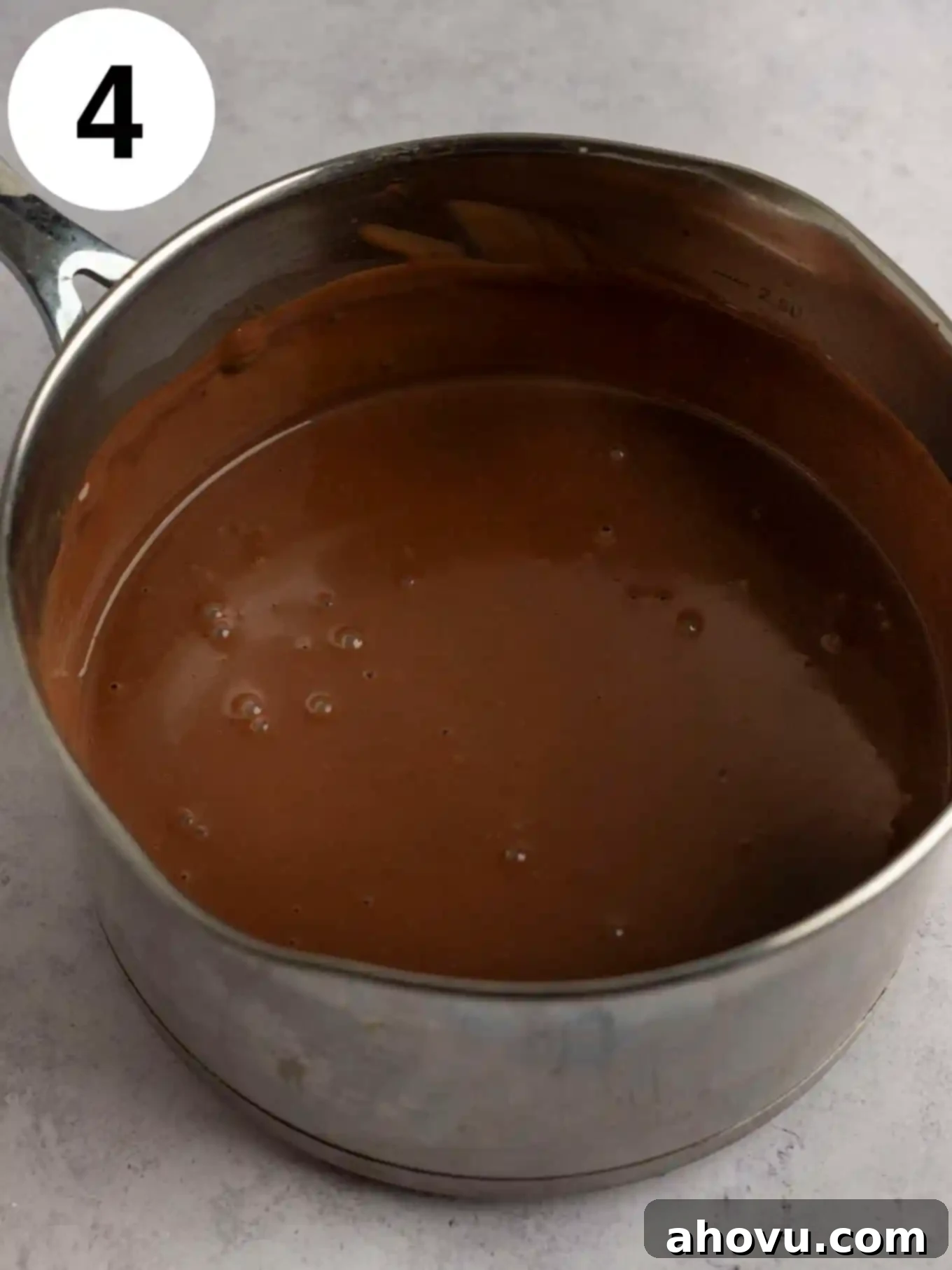 Decadent Chocolate Delight 7 An overhead view of a chocolate pudding in a metal saucepan.