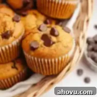 Cozy Pumpkin Chocolate Morsel Muffins 10 Several pumpkin chocolate chip muffins in a basket.