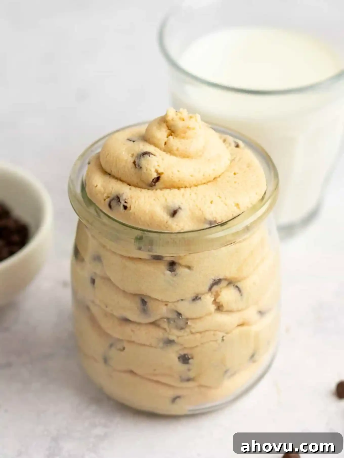 Beautifully piped edible cookie dough frosting presented in a charming glass jar, highlighting its delightful texture and readiness for serving or gifting.