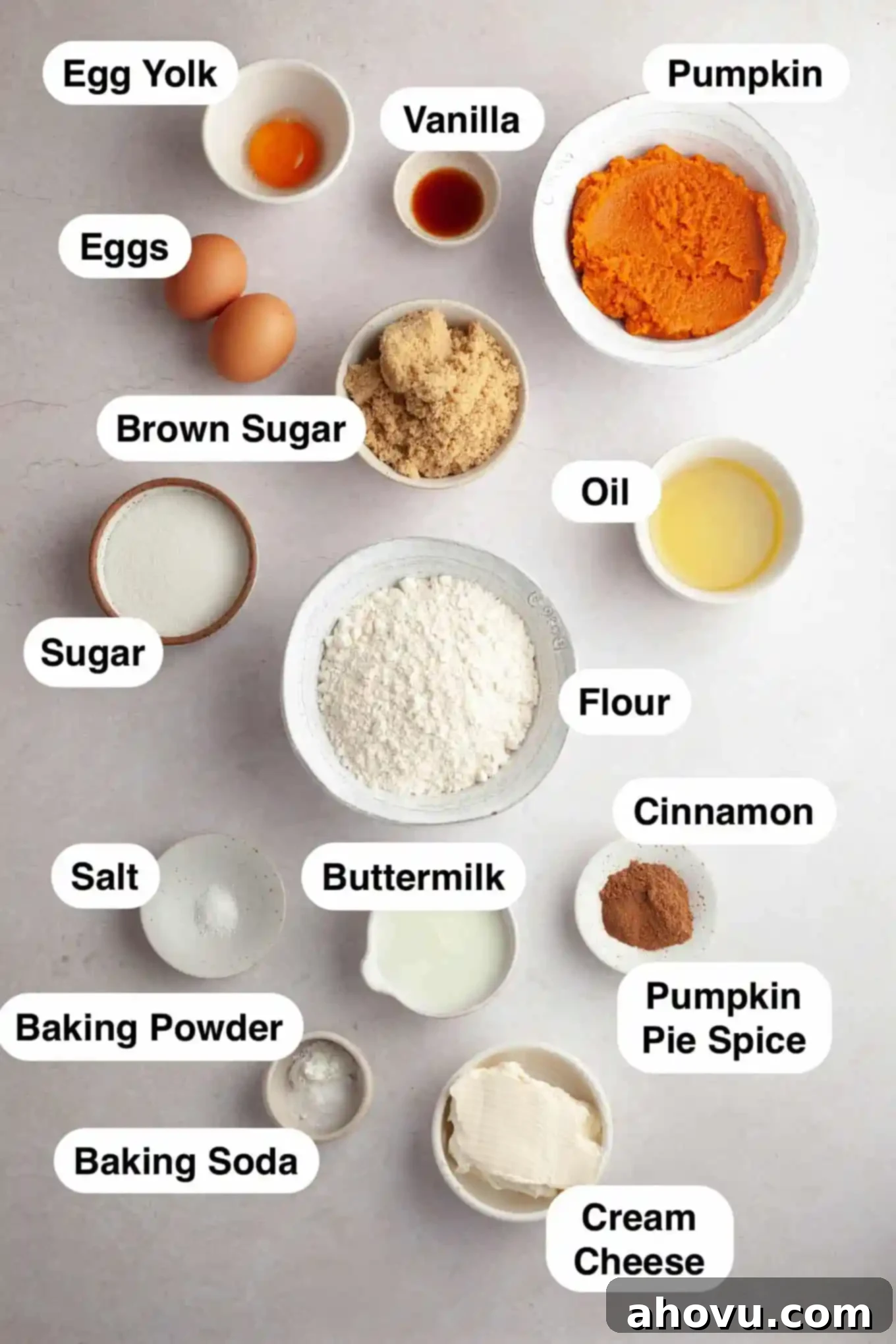 Pumpkin Swirl Cream Cheese Bread 3 An overhead view of various baking ingredients, including pumpkin puree, spices, flour, and cream cheese, neatly arranged on a counter before being used to make pumpkin bread.