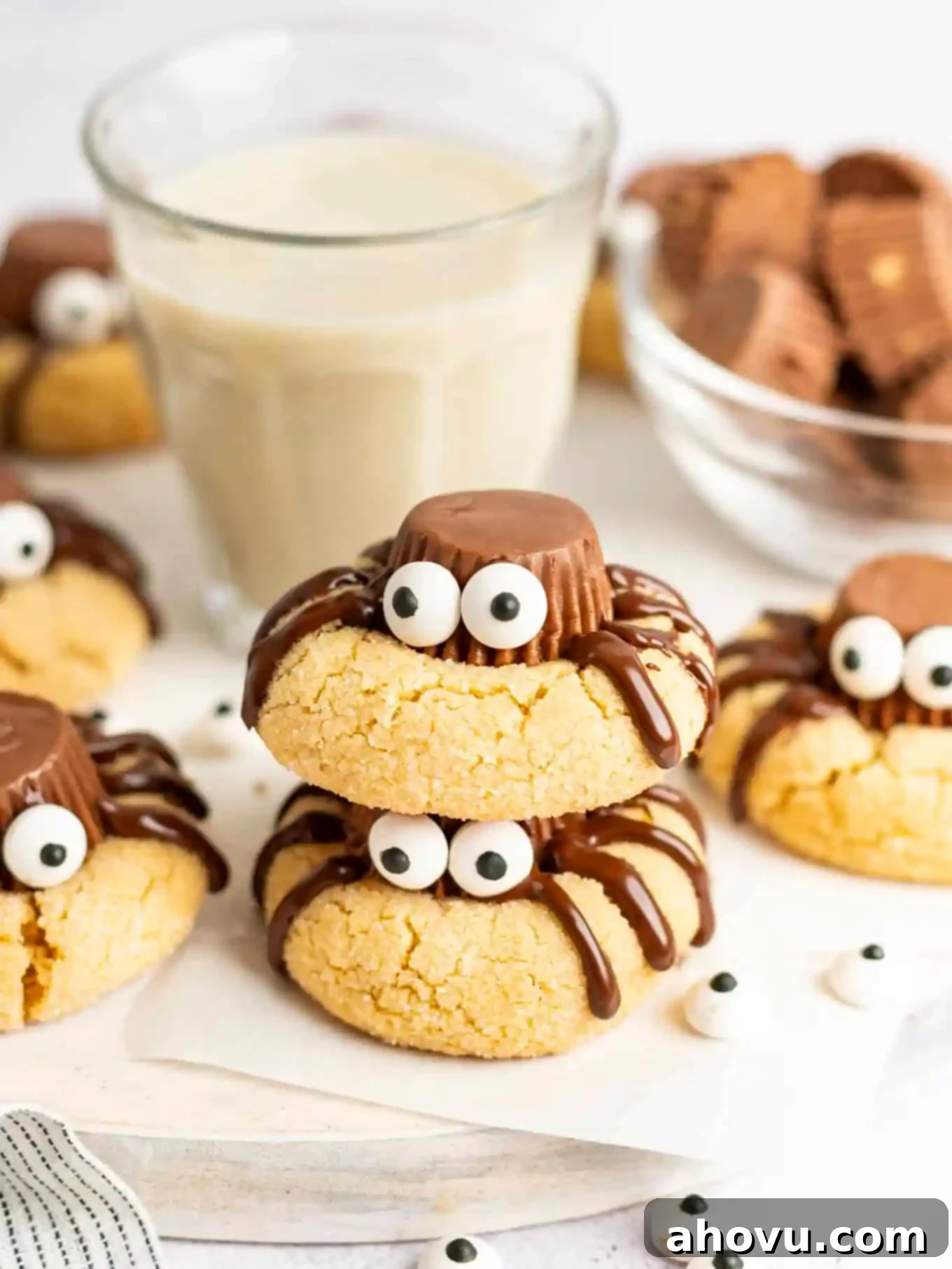 Creepy Crawly Cookie Bites 11 Cute spider cookies stacked around a glass of milk.