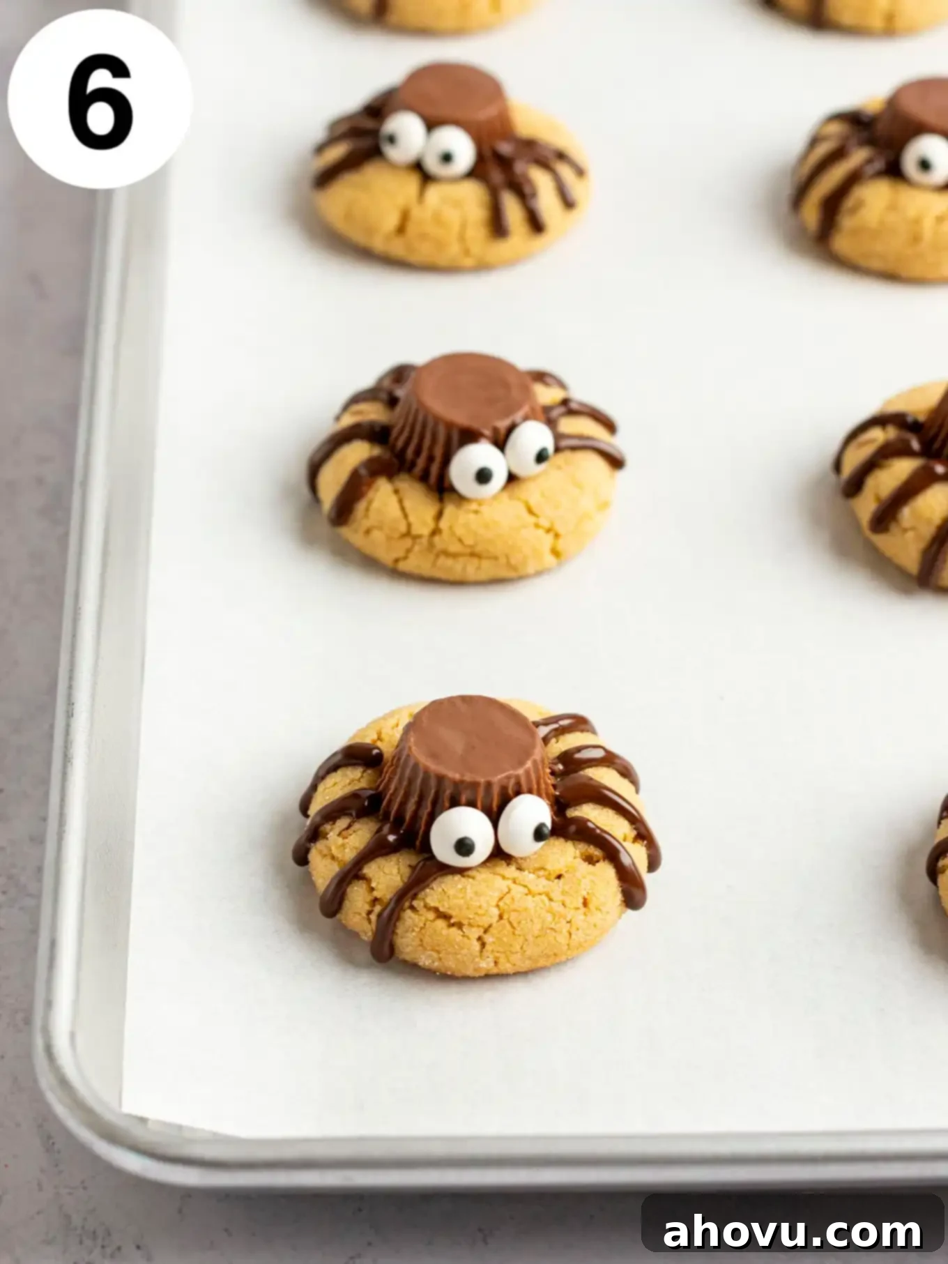 Creepy Crawly Cookie Bites 9 A process shot showing spider cookies after the candy eyes have been added.