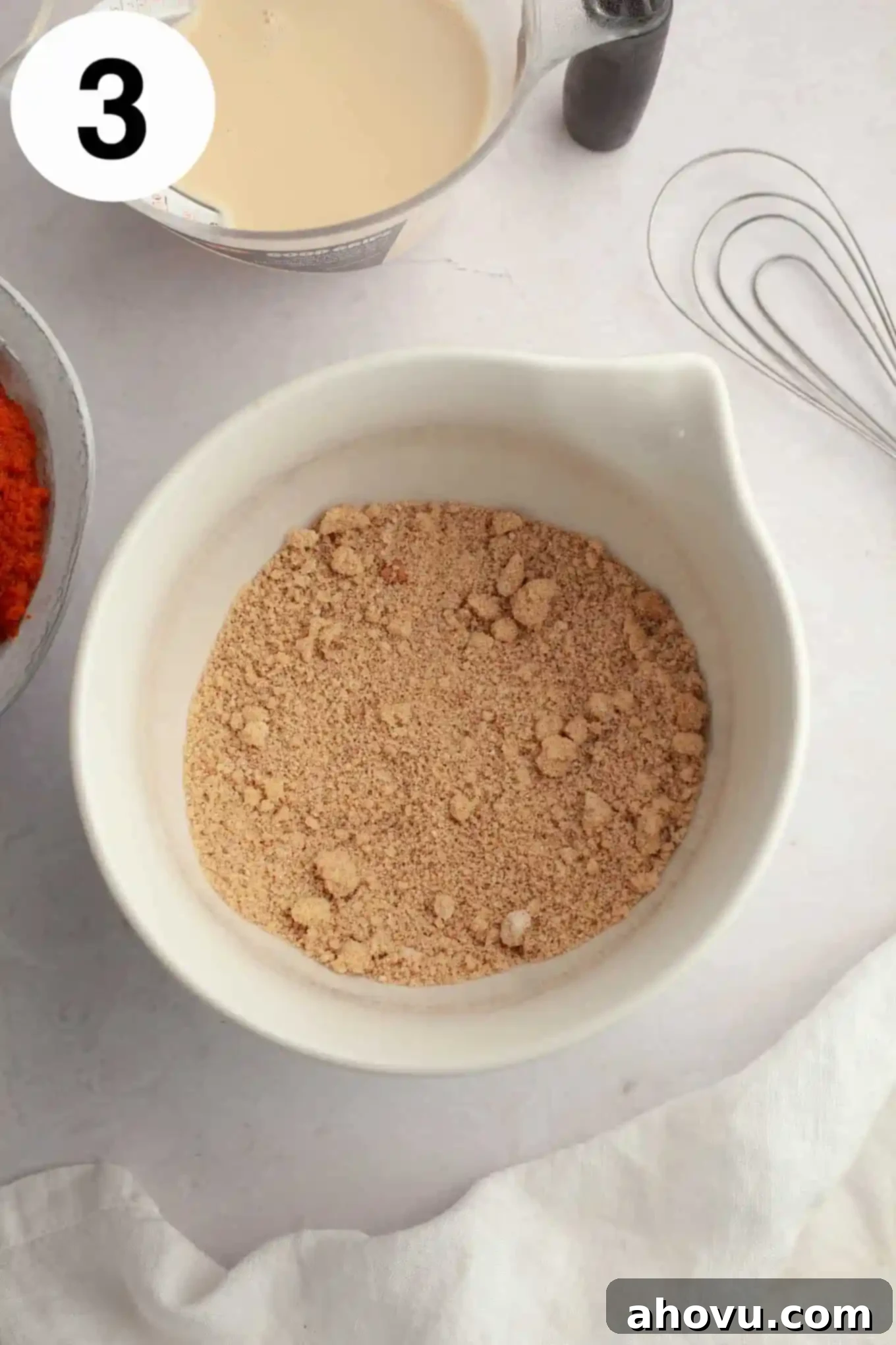 Harvest Spice Pumpkin Bars 6 An overhead view of a flour and brown sugar mixture in a mixing bowl.