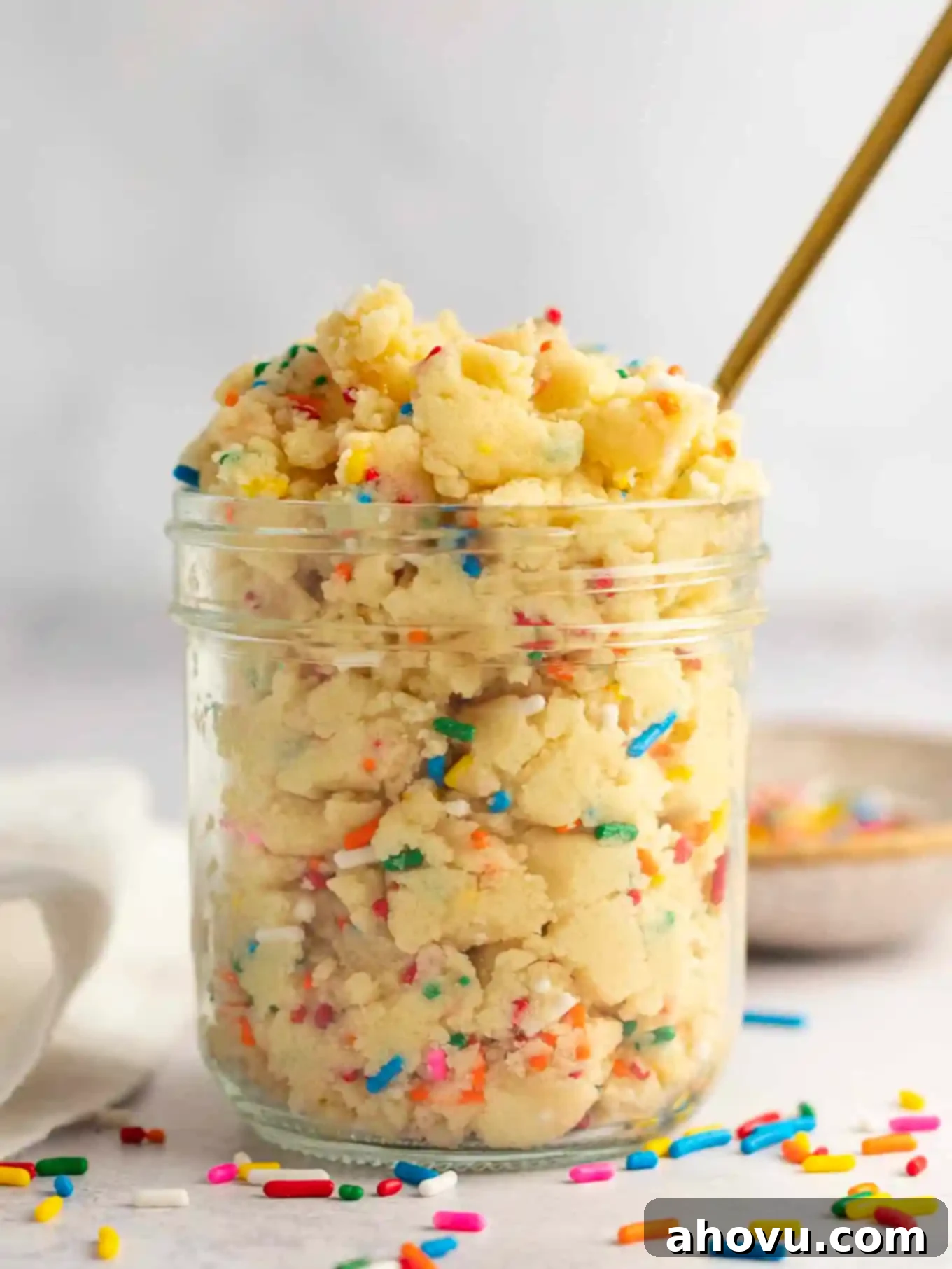 Guilt-Free Sugar Cookie Dough 2 A mason jar filled with a generous portion of edible sugar cookie dough, ready to be enjoyed.