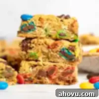 A stack of three monster cookie bars.