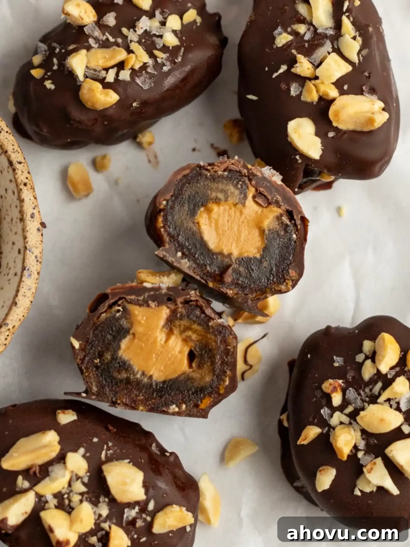 An overhead view of a date Snickers cut in half to show the filling. 