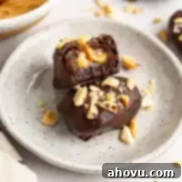 A date snickers on a speckled white plate.