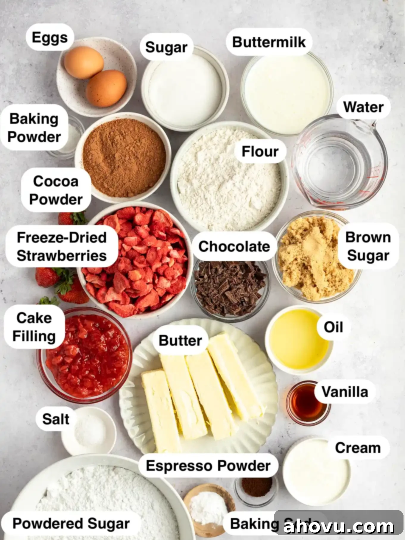 The ingredients needed to make a chocolate cake with strawberry frosting and filling. 