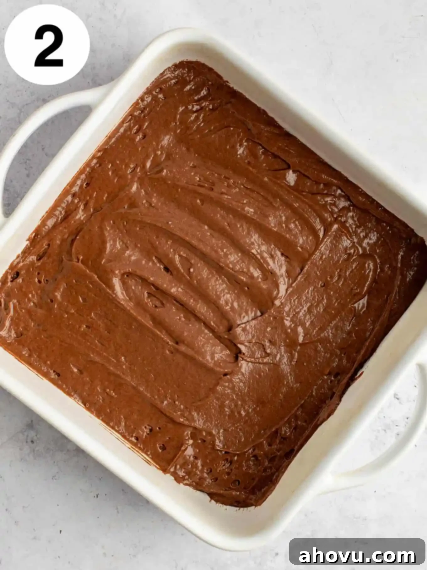Decadent Chocolate Pudding Cake 5 An overhead view of chocolate cake batter in a baking dish.