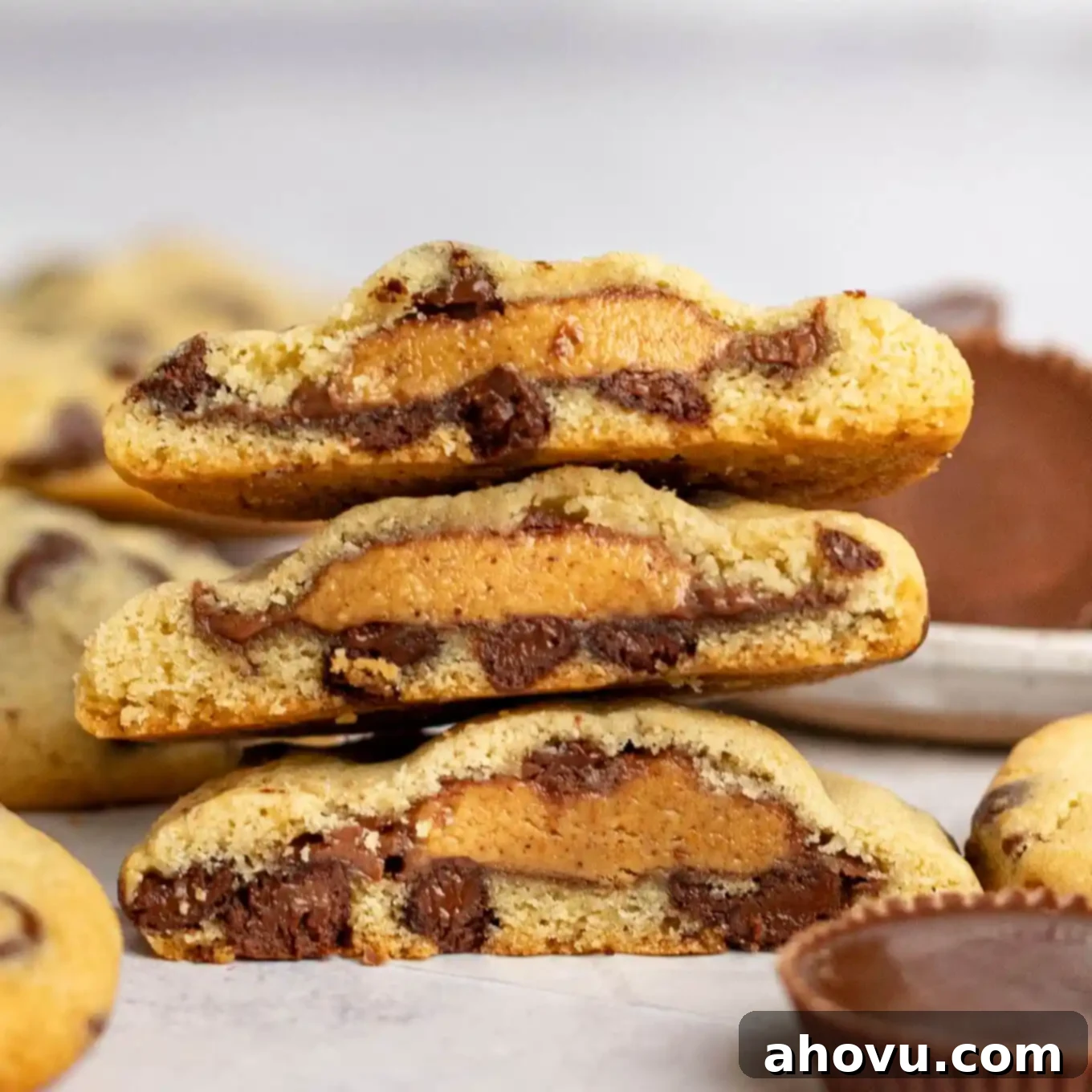 Reese's Peanut Butter Explosion Cookies 2 Three Reese's stuffed cookies cut in half and stacked atop each other.