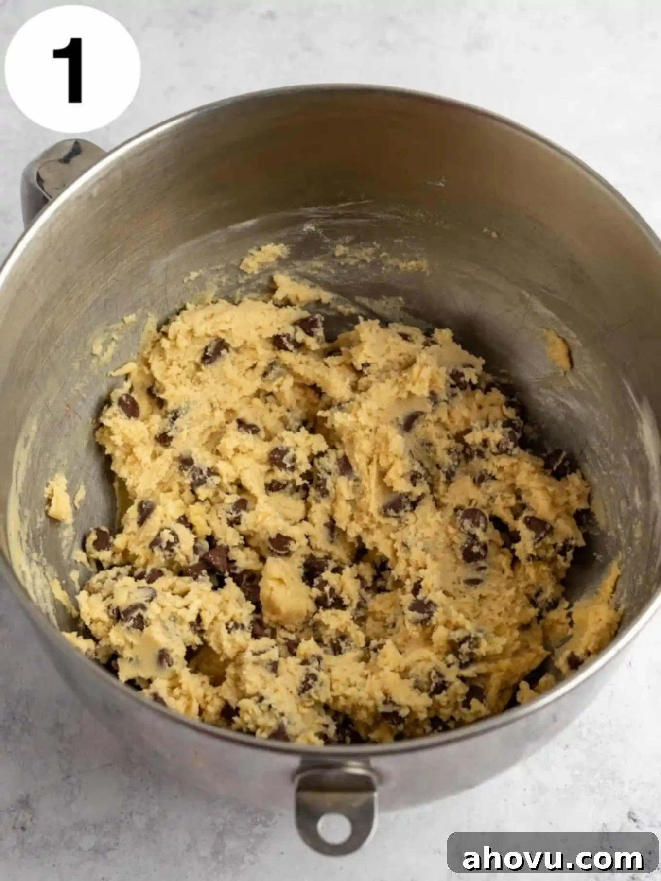 Reese's Peanut Butter Explosion Cookies 4 Raw chocolate chip cookie dough in the bowl of a stand mixer.