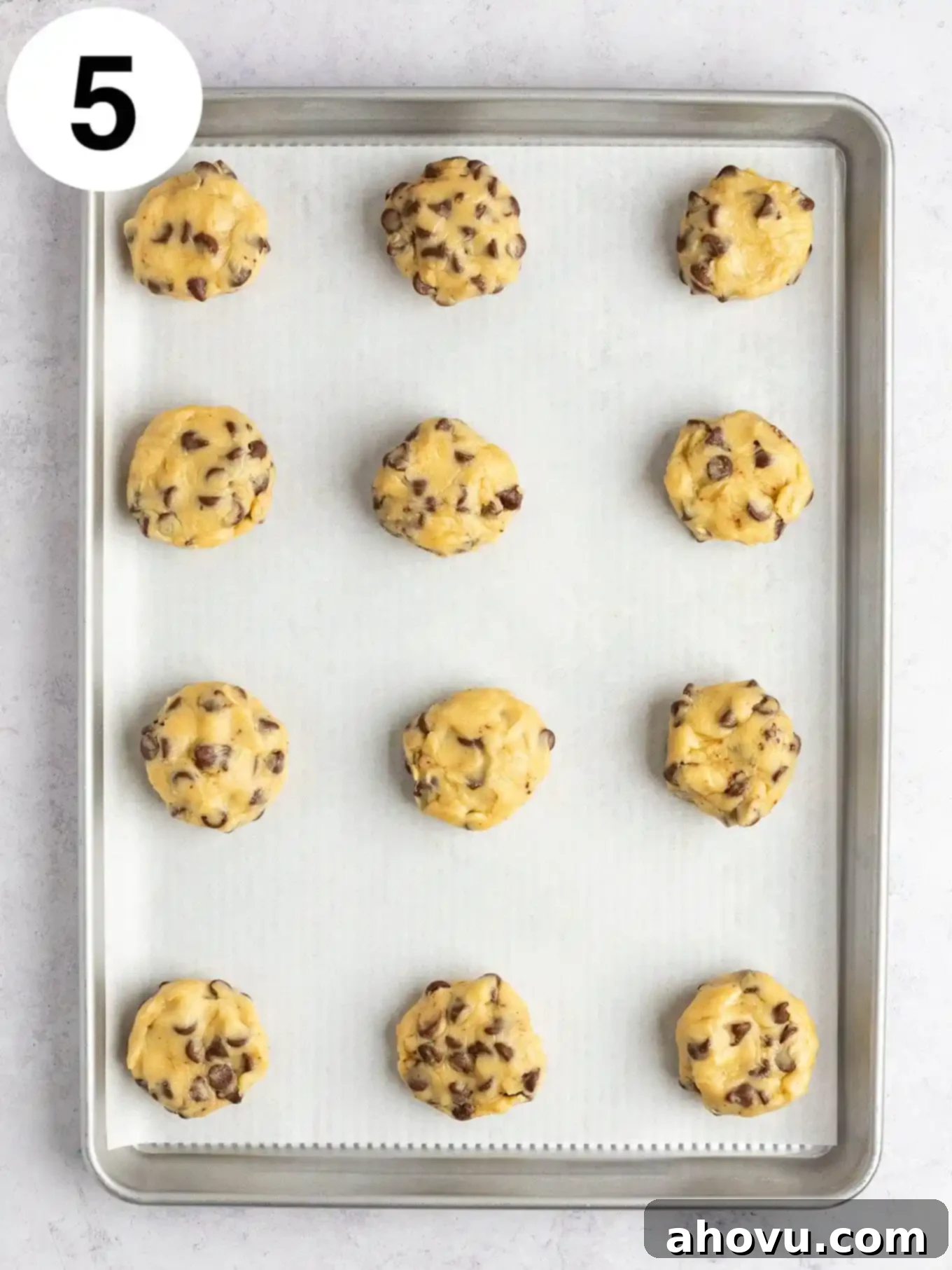 Reese's Peanut Butter Explosion Cookies 8 An overhead view of unbaked Reese's stuffed cookies on a baking sheet.