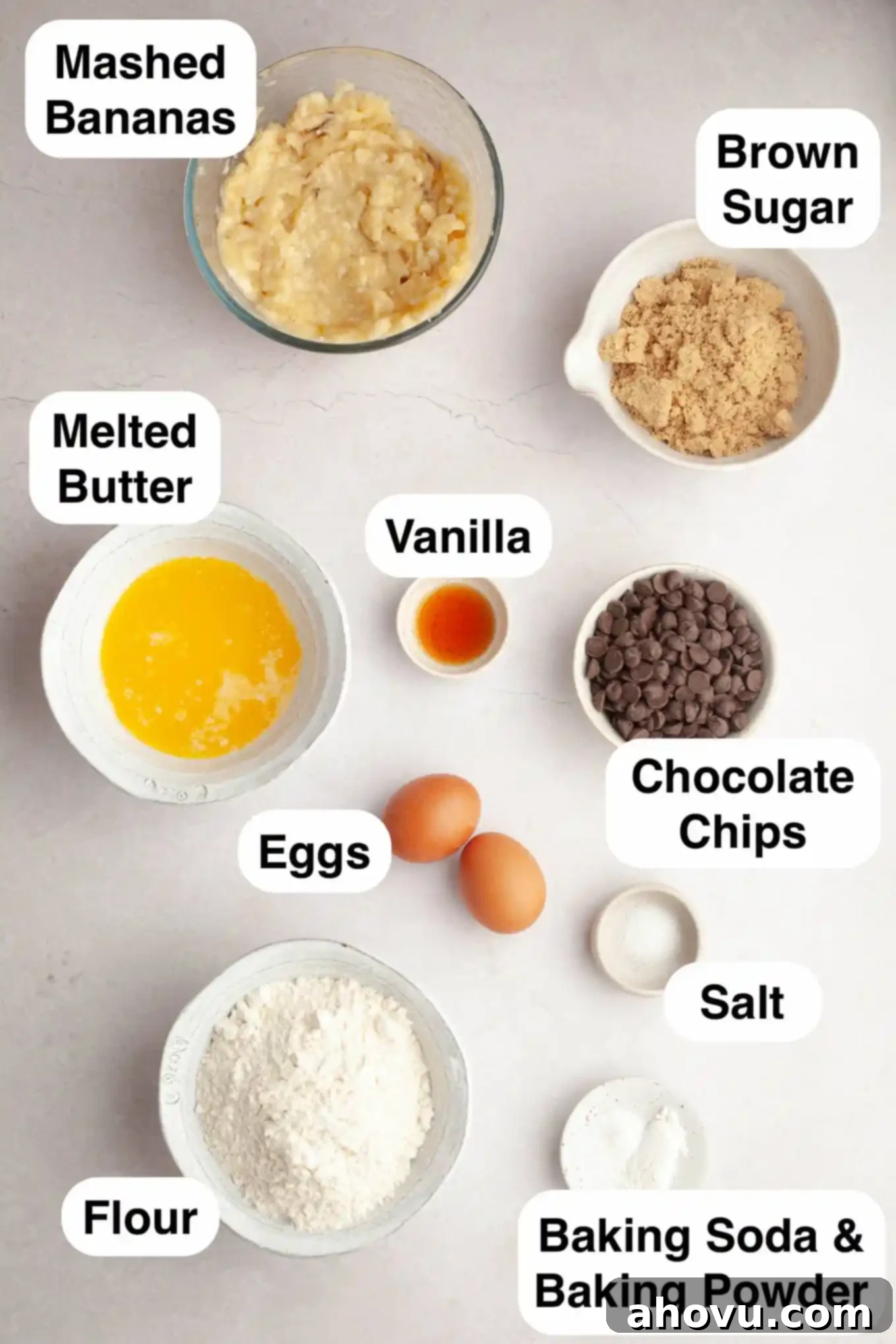 An overhead view of the ingredients laid out, ready to make chocolate chip banana bread.