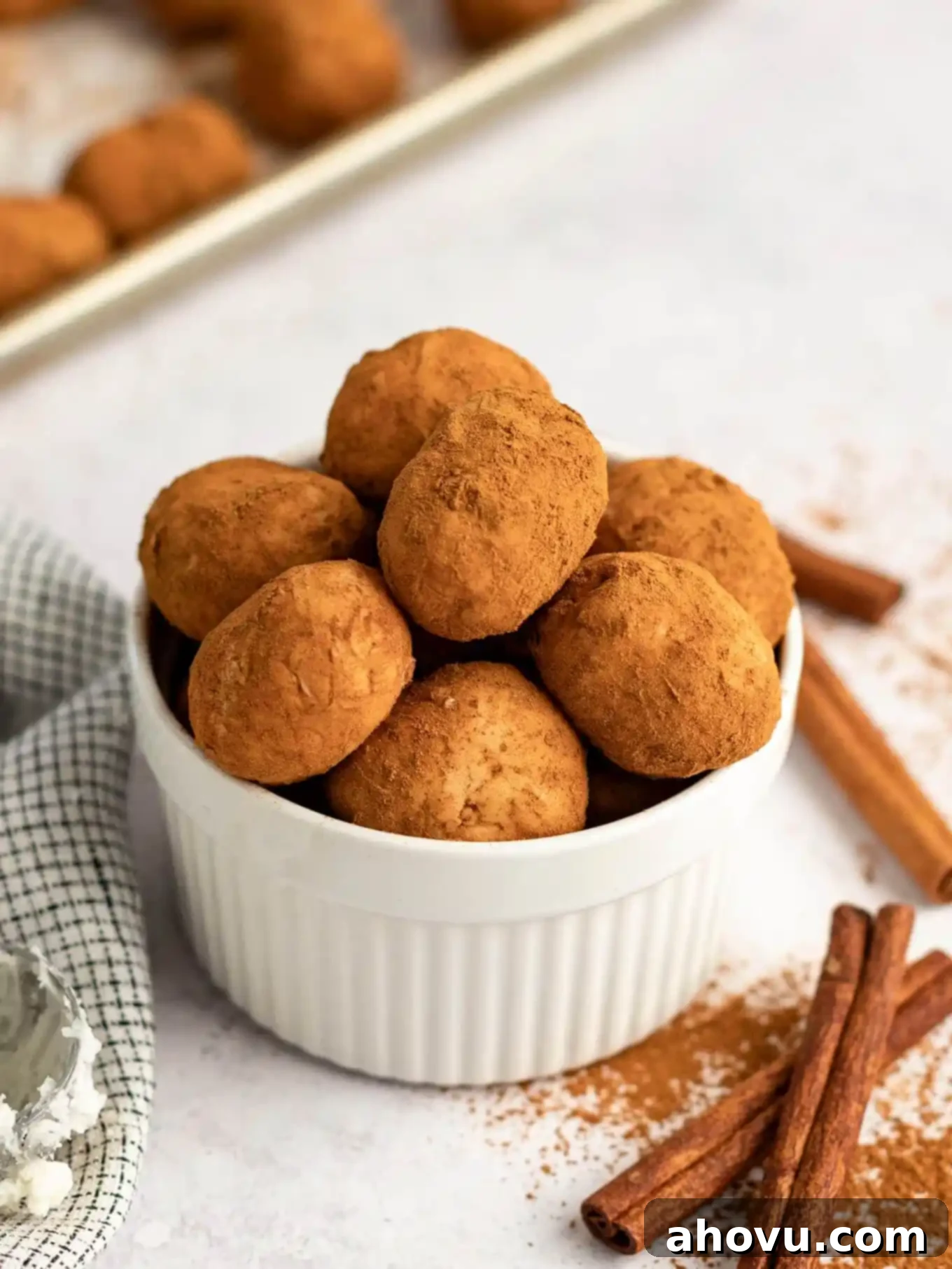 A ramekin brimming with perfectly formed Irish potato candy, ready for serving.
