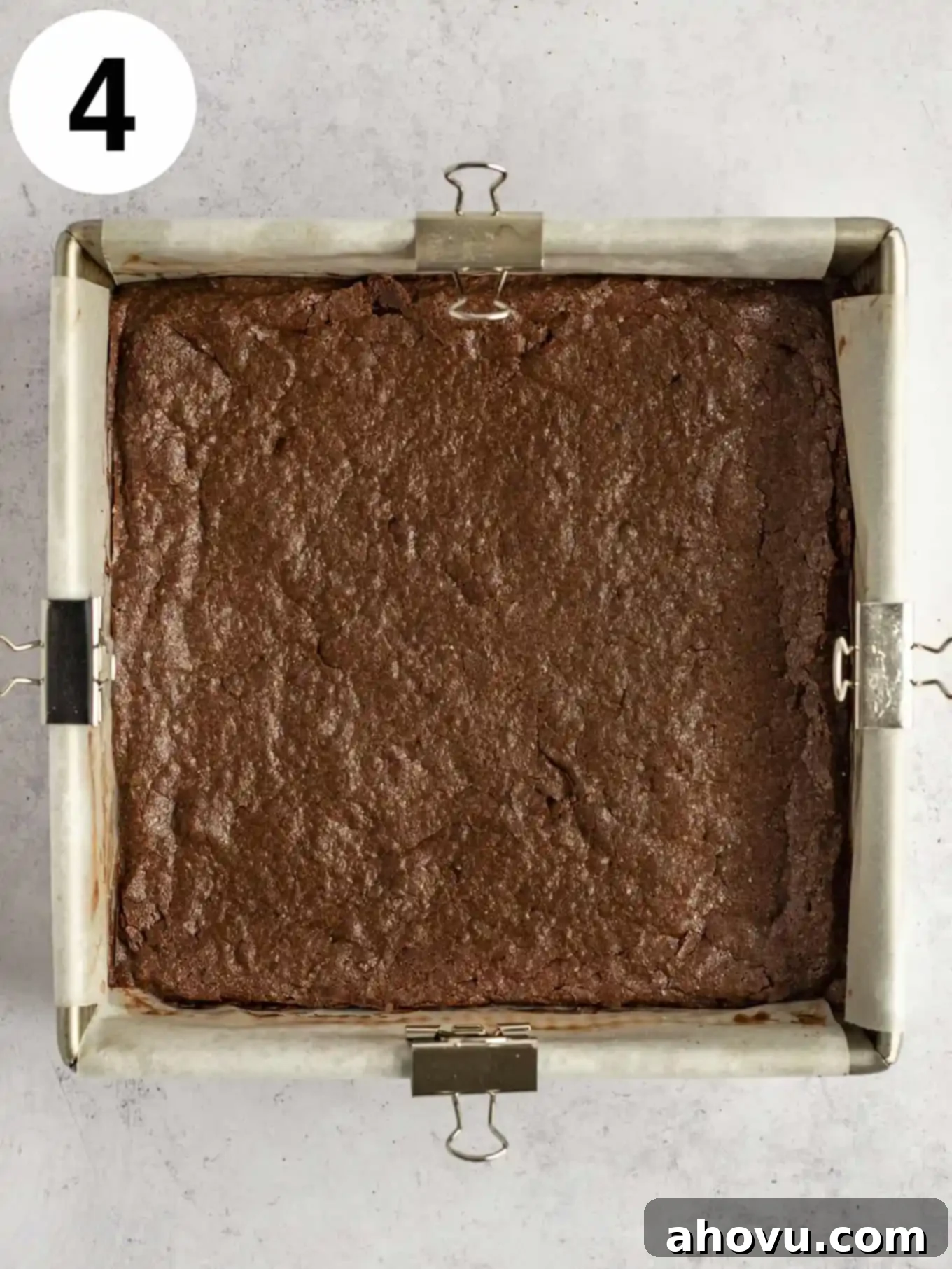 Decadent Mint Chocolate Brownies 7 A satisfying overhead view of perfectly baked, rich chocolate brownies cooling in their parchment-lined baking pan, ready for the next delectable layer.