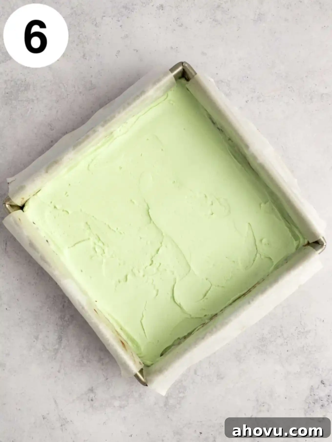 Decadent Mint Chocolate Brownies 9 An inviting overhead view of rich chocolate brownies generously topped with a lush, smooth layer of creamy green mint frosting.