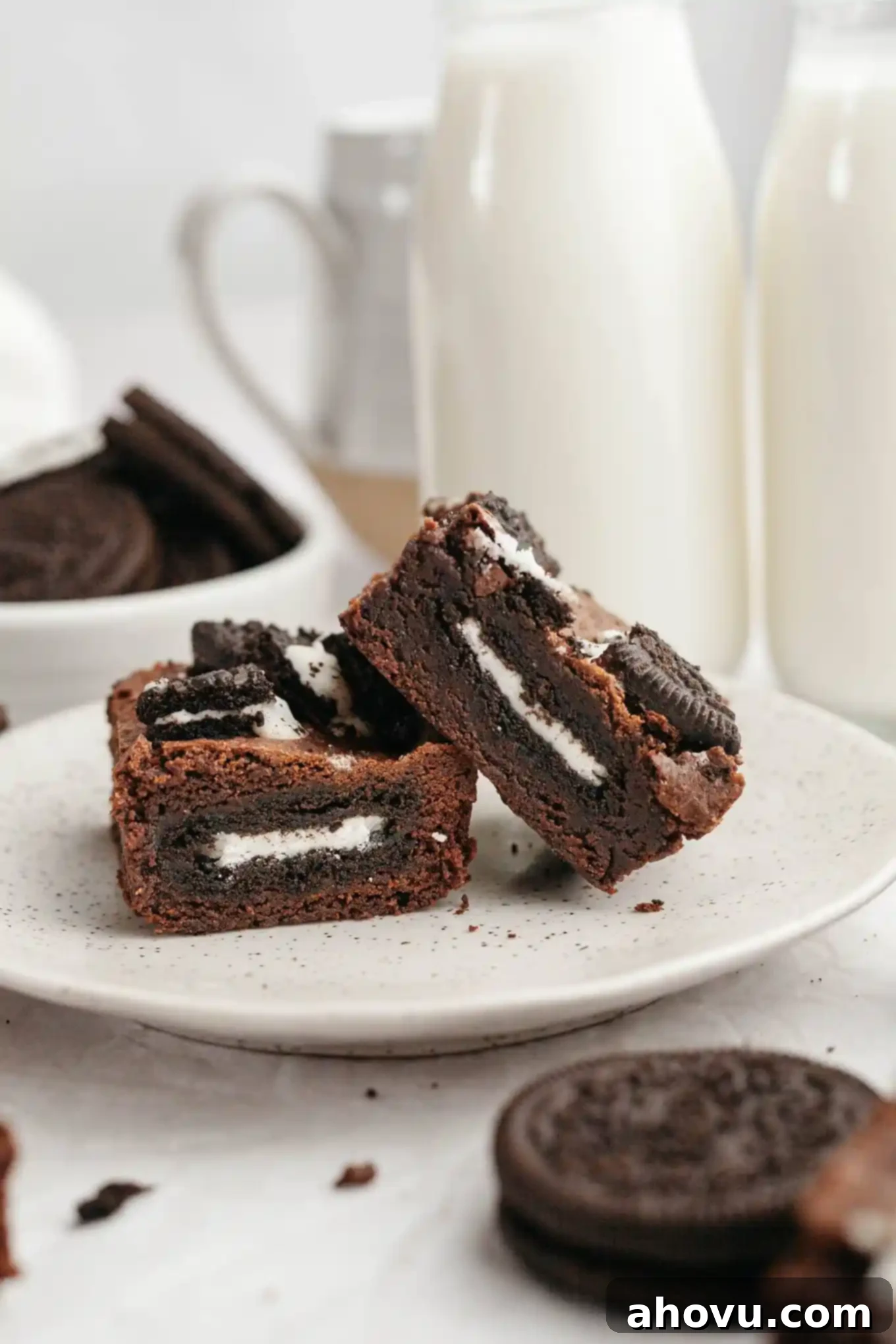 Ultimate Oreo Brownies 9 Two Oreo stuffed brownies on a white dessert plate.