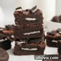 Ultimate Oreo Brownies 10 A stack of three Oreo brownies.