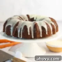 A carrot bundt cake with cream cheese icing.