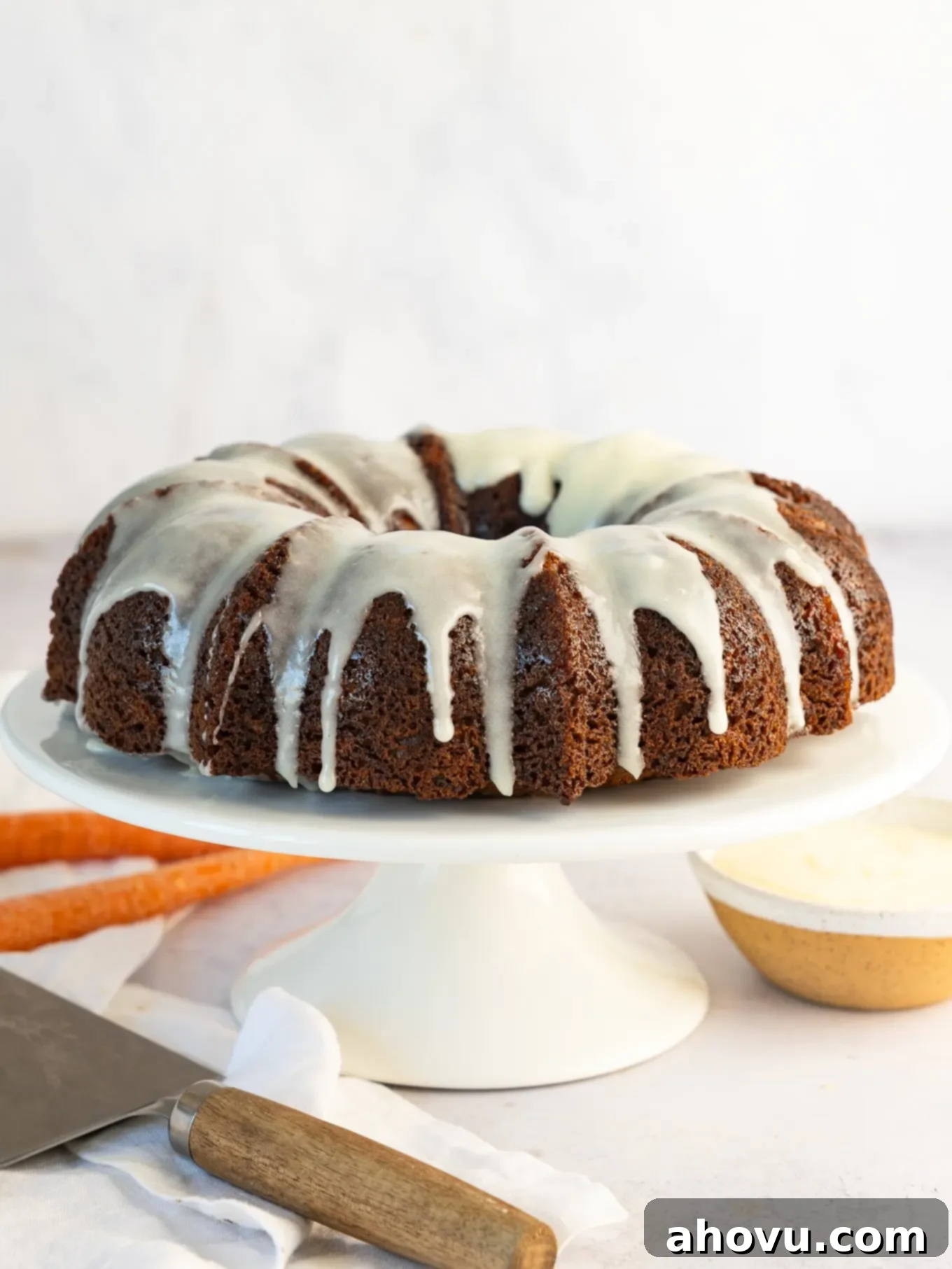 A carrot bundt cake with cream cheese icing.