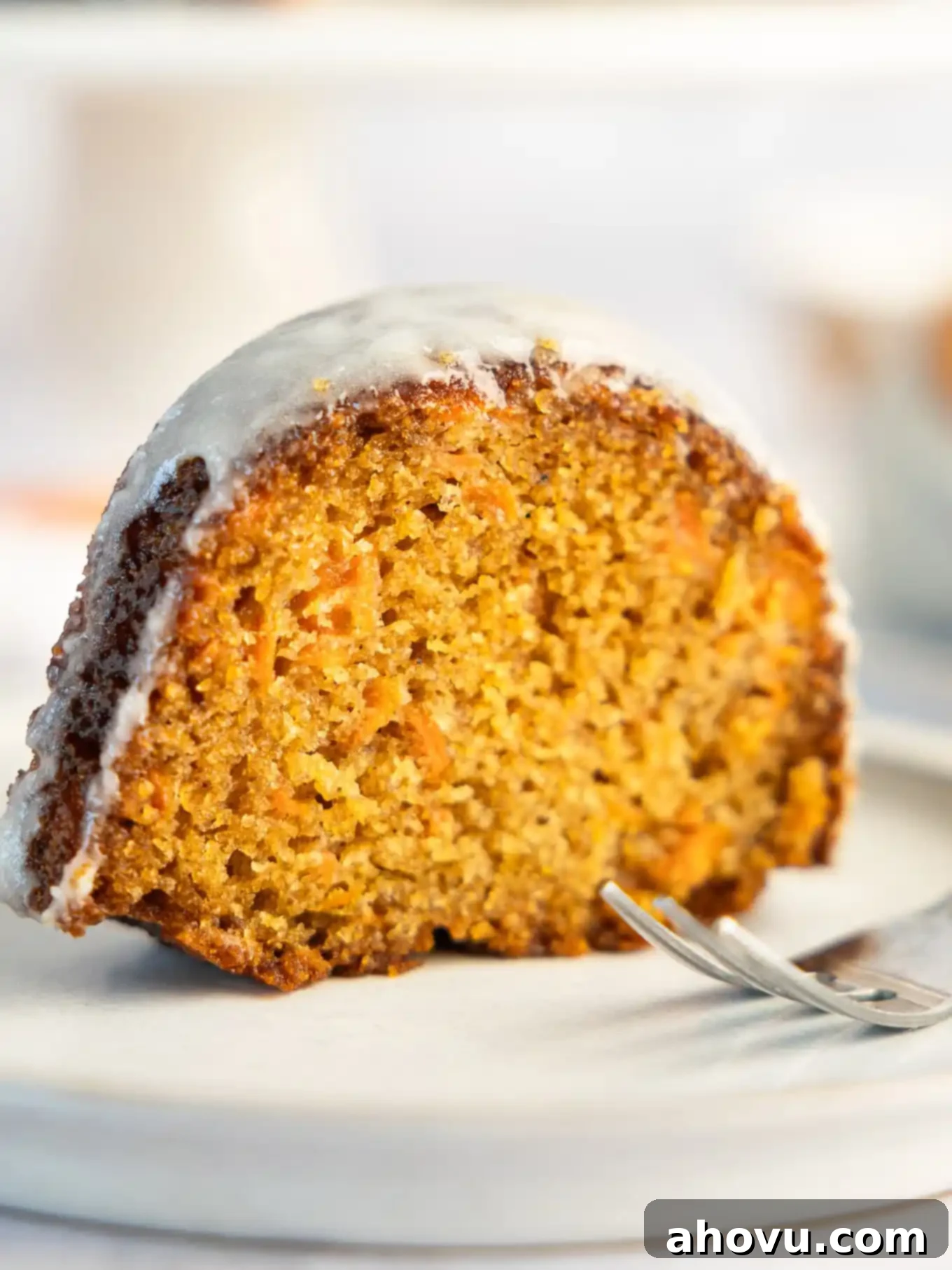 A slice of carrot bundt cake, seen from the side. 