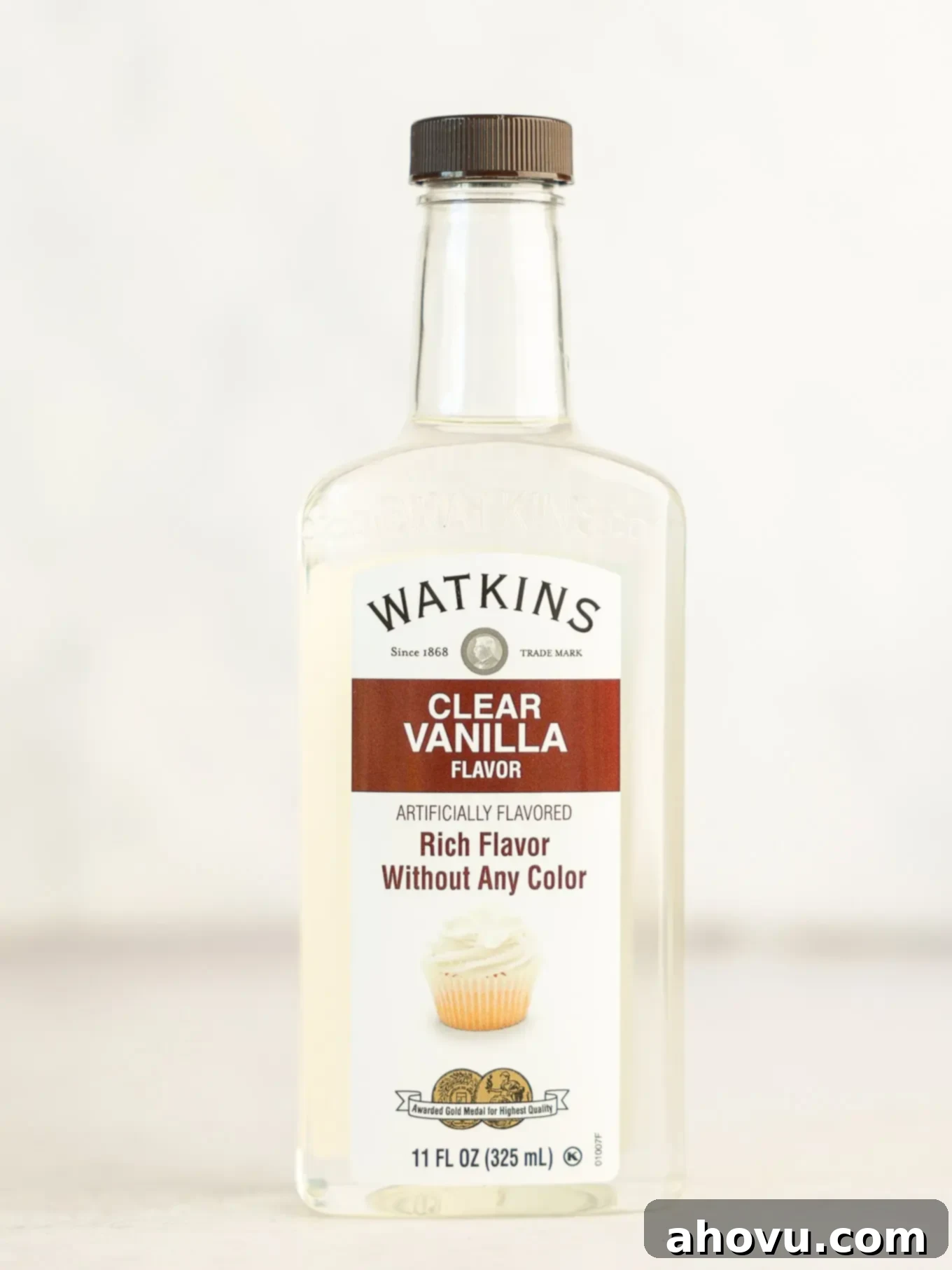 A bottle of clear vanilla extract, crucial for maintaining white cupcake color.