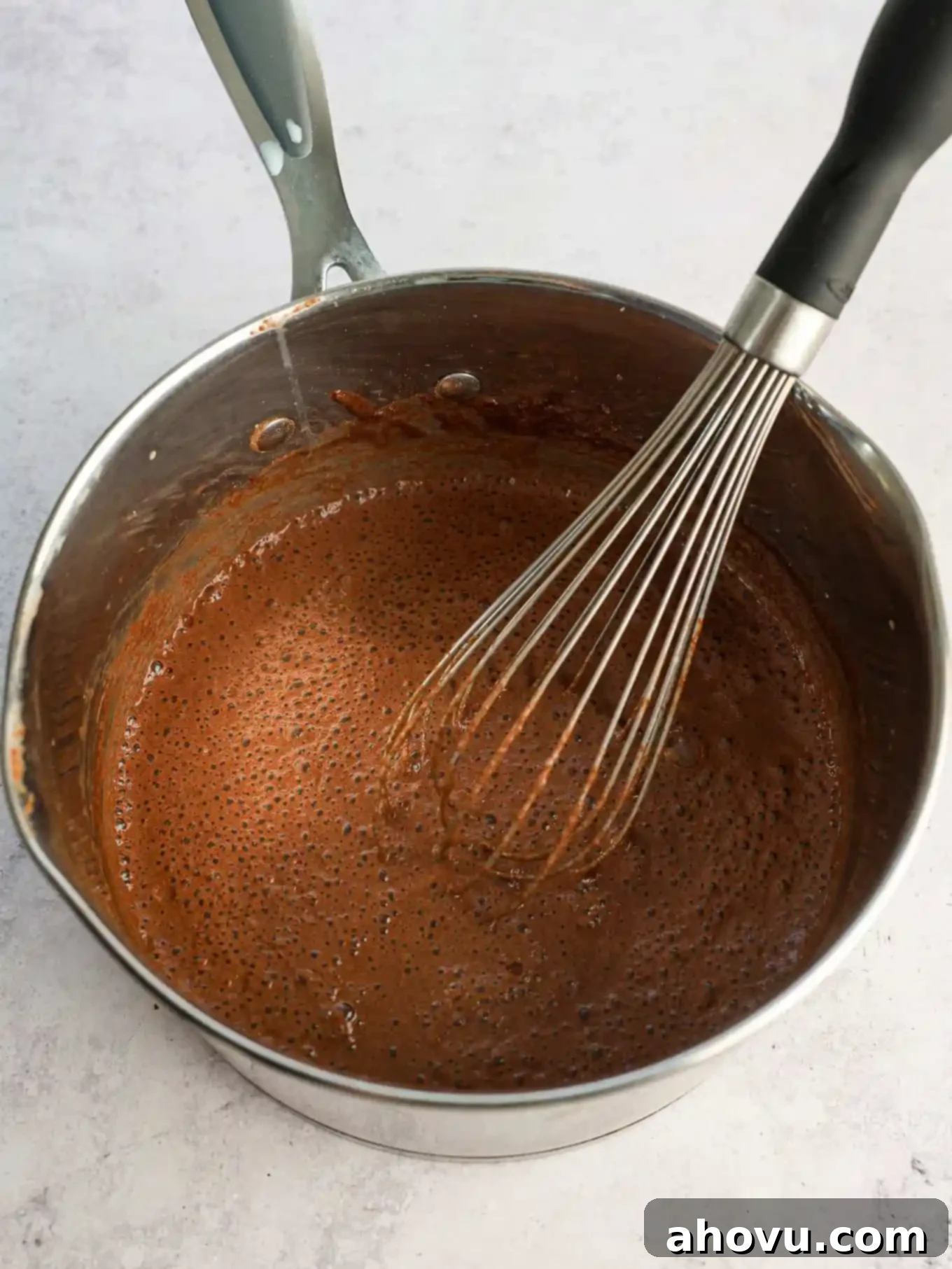 The mixture whisked together in a saucepan.