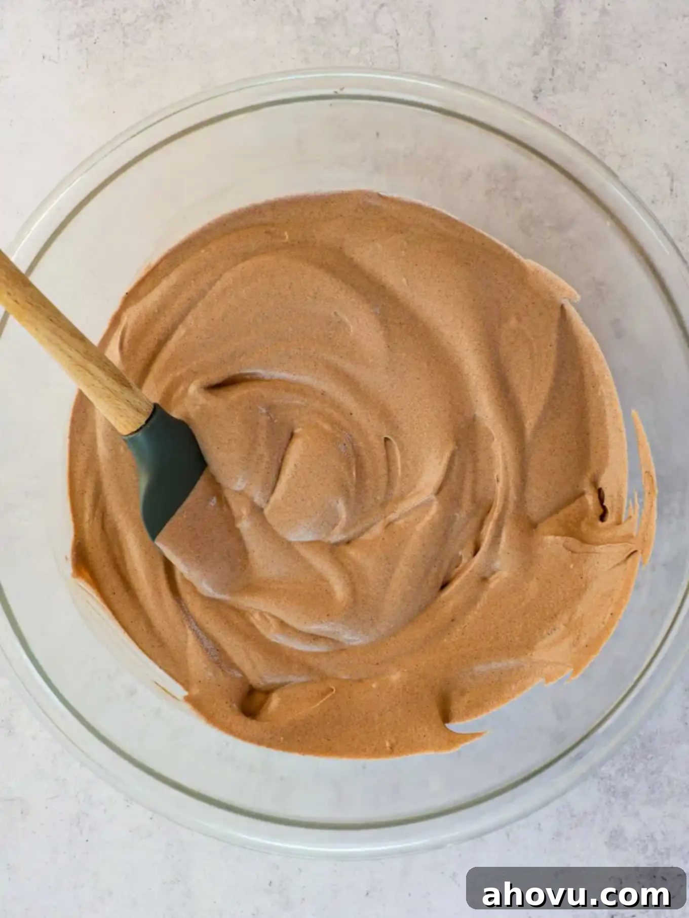 Decadent Chocolate Delight 7 A creamy no-churn chocolate ice cream mixture in a mixing bowl, perfectly blended and ready to be frozen.