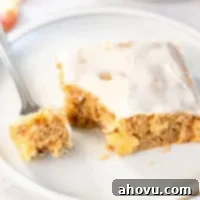 A slice of apple fritter cake on a plate.