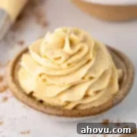 A small bowl with pumpkin spice whipped cream piped into it.