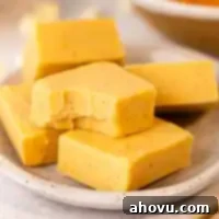 Pumpkin Spice Fudge 10 Several pieces of pumpkin fudge on a plate.