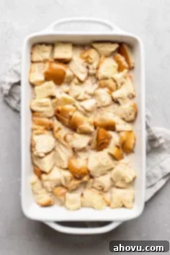 The bread pudding mixture, thoroughly soaked and settled in the baking pan, ready to go into the oven.