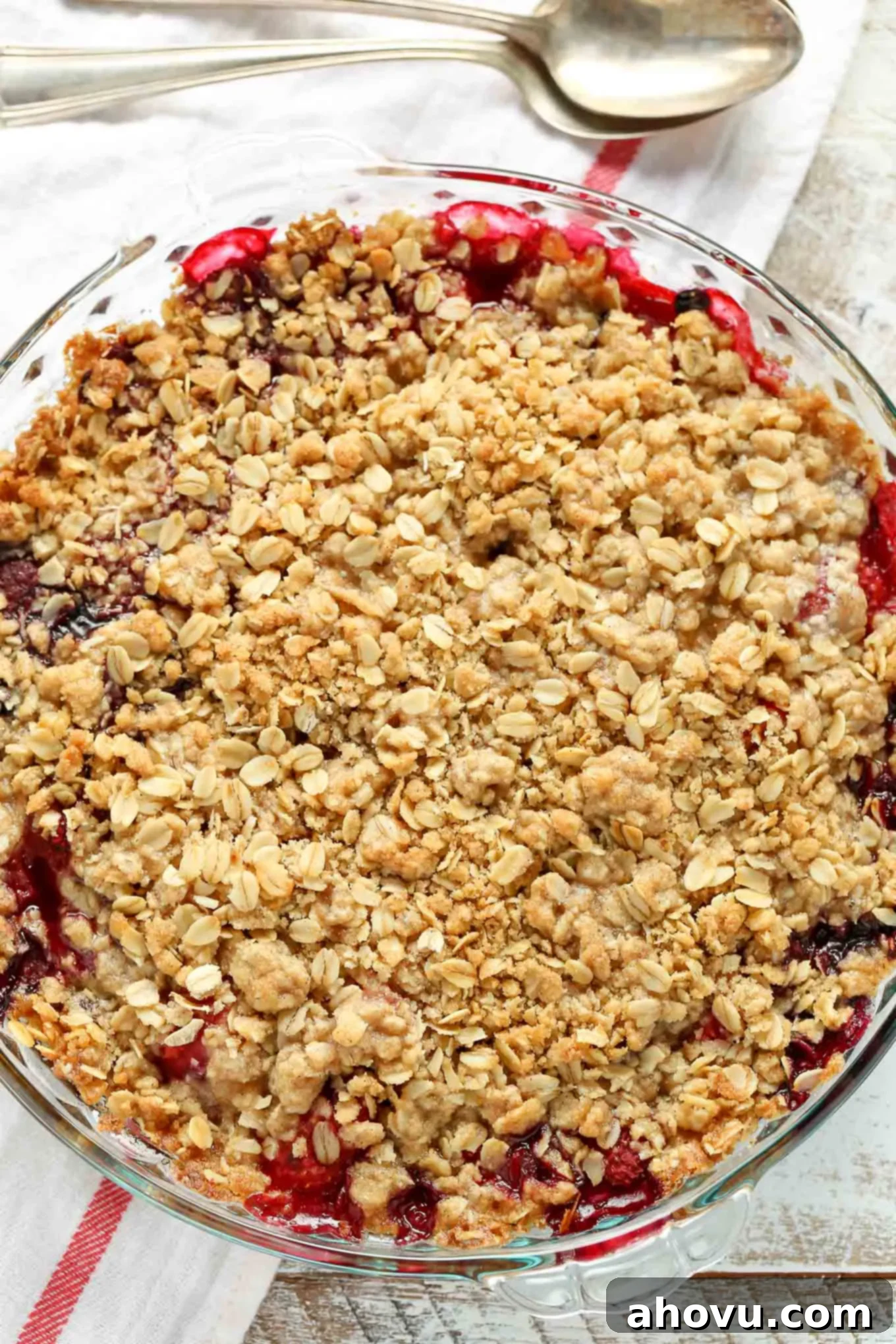 A mixed berry crisp in a glass pie plate, seen from above. 