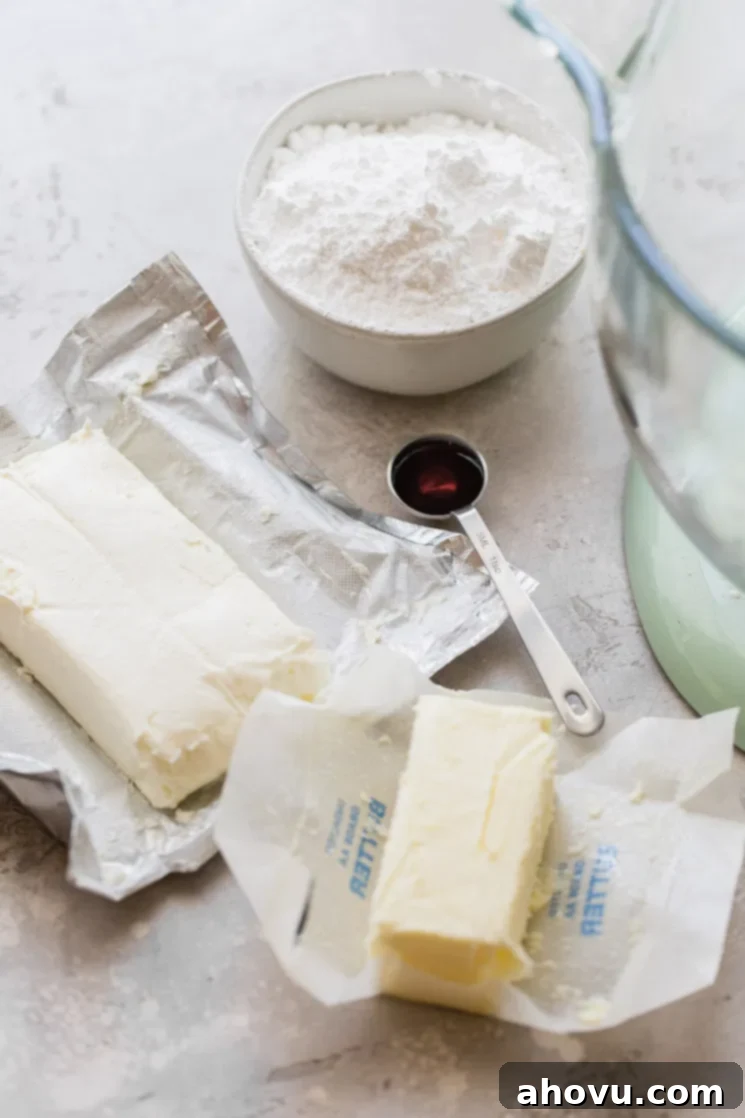 Velvet Cream Cloud 3 The ingredients needed to make cream cheese frosting laying on a gray surface.