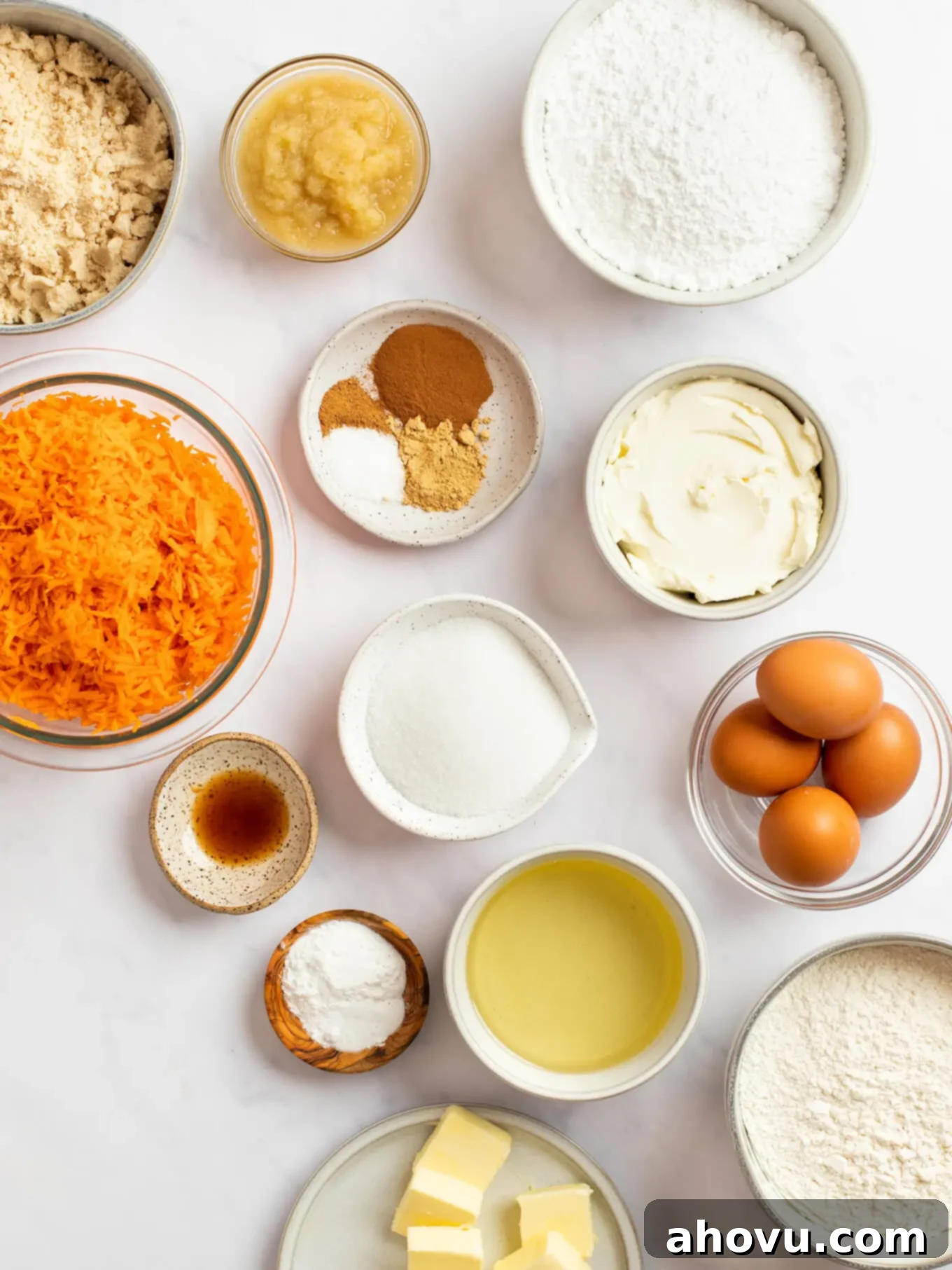 Irresistible Carrot Cake Delight 3 An overhead view showcasing all the fresh ingredients needed for the carrot cake, neatly arranged on a pristine marble surface, ready for baking.