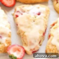 Homemade Strawberry Cream Scones 7 A freshly baked strawberry scone, beautifully golden brown, with a light glaze. Ready to be enjoyed.