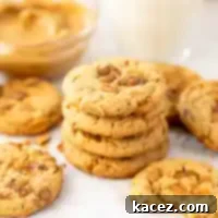 Sweet & Crunchy Butterfinger Treats 9 A stack of perfectly baked Butterfinger cookies on a piece of parchment paper, highlighting their delicious texture.