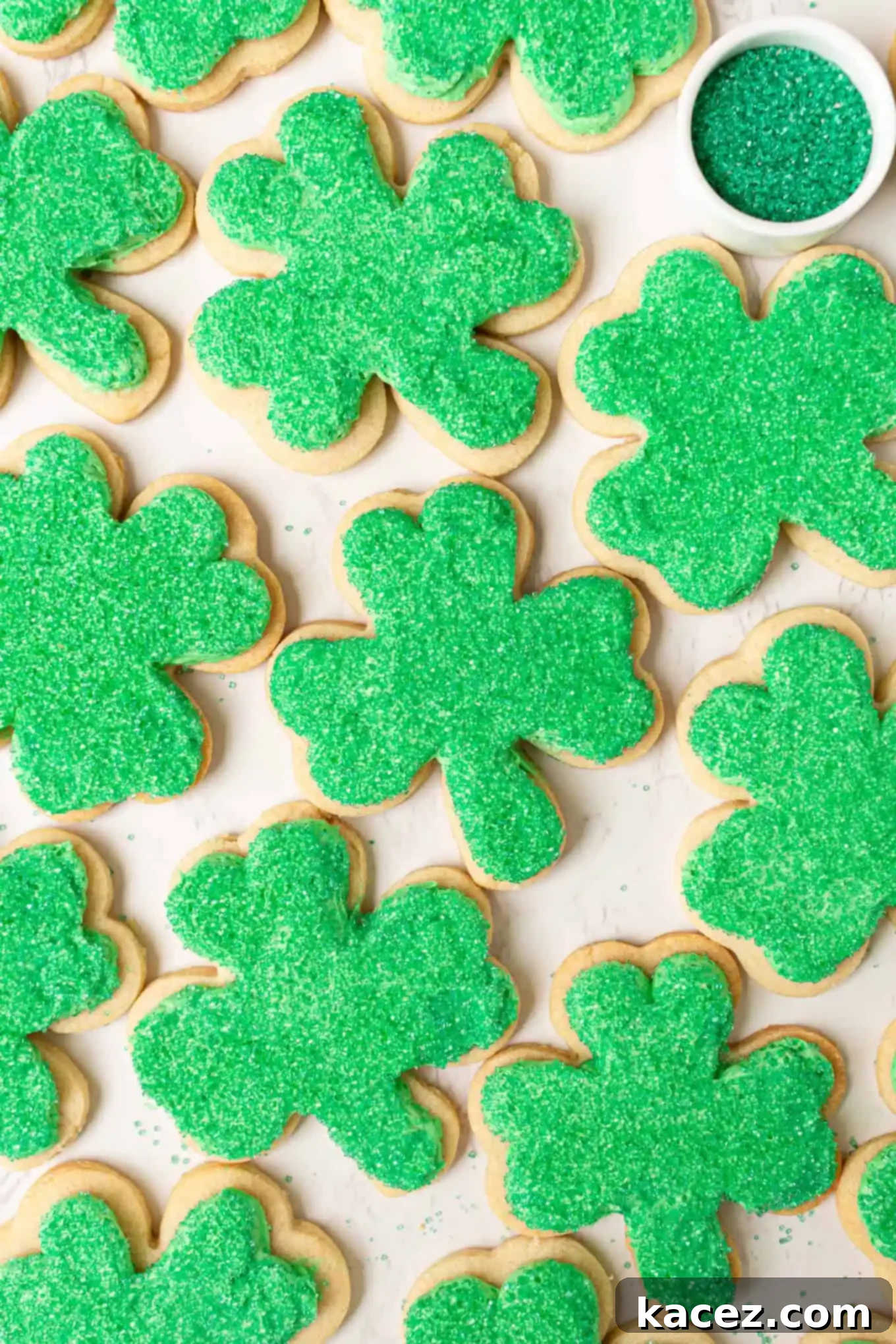 Overhead view of beautifully frosted shamrock cookies, perfect for a St. Patrick's Day celebration.