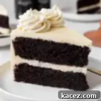 A slice of Guinness chocolate cake frosted with Baileys buttercream frosting.