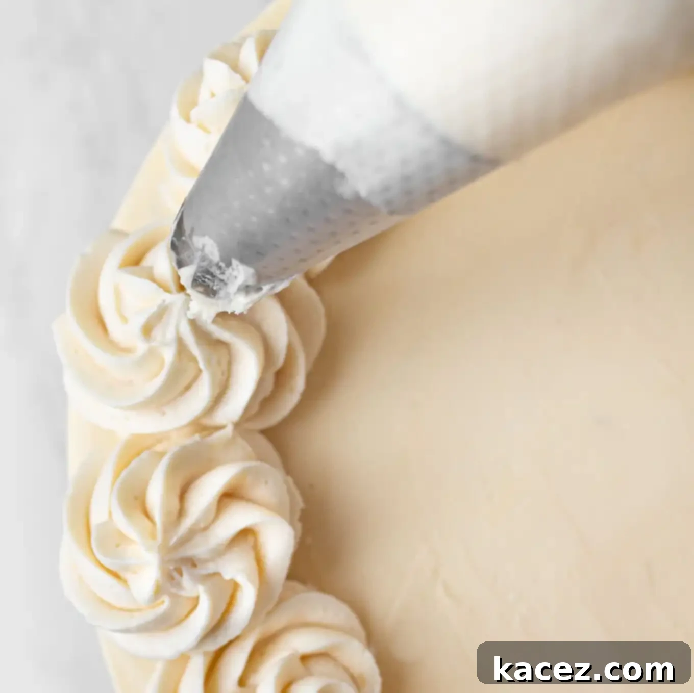 Guinness Chocolate Dream Cake 8 Expertly piping frosting around the top edge of the Guinness chocolate cake.